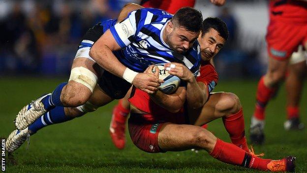 Elliott Stooke and Alex Lozowski compete for the ball