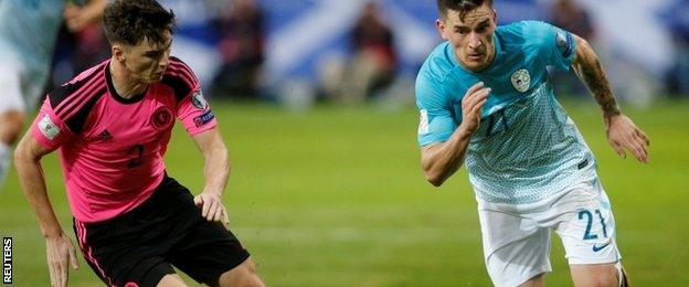 Kieran Tierney chases the ball against Slovenia