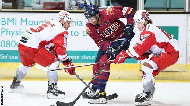 Devils' Ben Davies and Josh Waller in action against Guildford