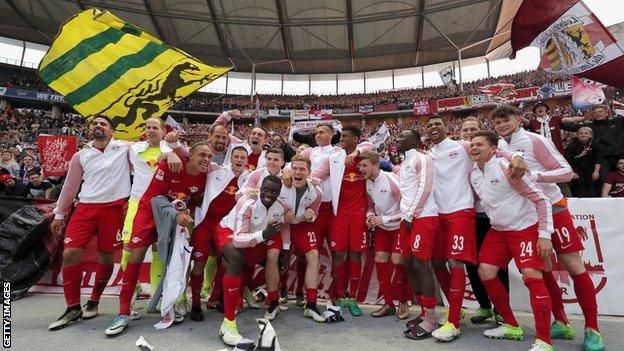 RB Leipzig players celebrate after a 4-1 win over Hertha Berlin secured a place in next season's Champions League group stage