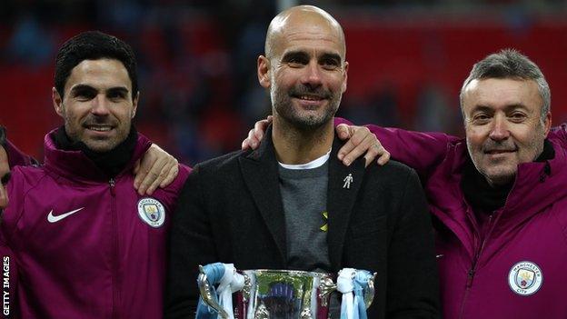 Pep Guardiola celebrates his first major trophy as Manchester City boss with his assistants Mikel Arteta and Domenec Torren