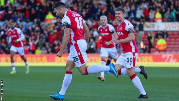 Harry Lennon celebrates after scoring for Wrexham