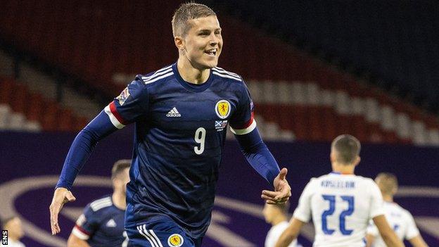 Lyndon Dykes celebrates his goal against Slovakia