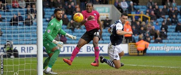 Souleymane Coulibaly (centre) in action for Peterborough against Millwall