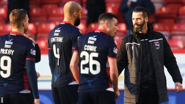 Ross County manager Stuart Kettlewell greets his players