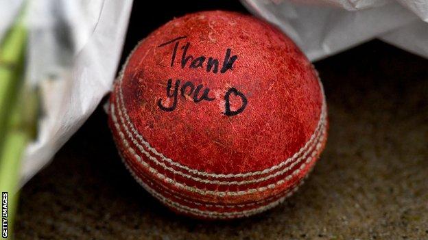 A cricket ball left at Shane Warne's statue at the MCG