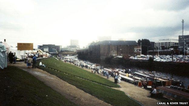 Views of the River Irwell in Manchester showing many leisure narrowboats at a rally. Taken in 1988.