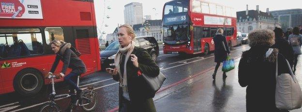 Buses and passers by Westminster bridge