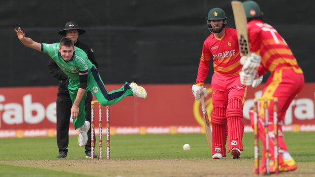 Ireland's Josh Little sends down a delivery to Zimbabwe captain Craig Ervine