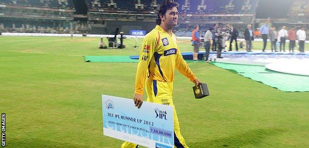 MS Dhoni walks off the field with a cheque for 75m rupees