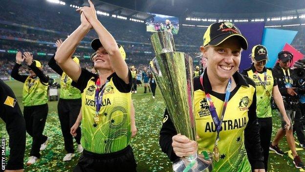 Alyssa Healy and the Australia team celebrate with the Women's T20 World Cup trophy