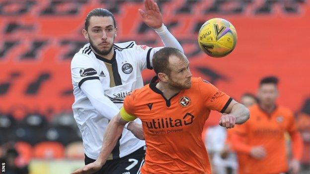 Aberdeen striker Fraser Hornby and Dundee United's Mark Reynolds