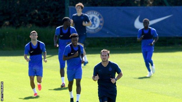 Chelsea manager Frank Lampard leads his players in a running session during Tuesday's training.