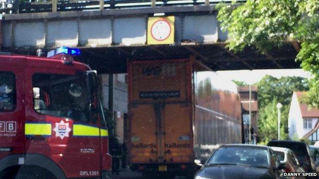 The Halfords lorry stuck under the bridge