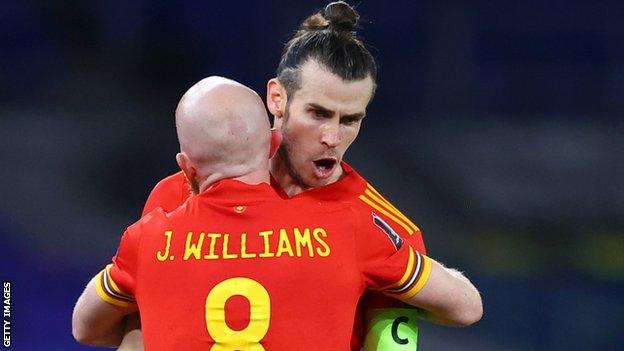 Gareth Bale celebrates with Jonny Williams