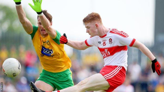 The block comes in as Derry forward Declan Cassidy goes for a point in the quarter-final against Donegal