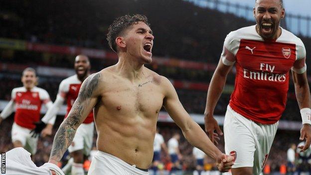 Lucas Torreira celebrates scoring Arsenal's fourth goal against Tottenham with his team-mates