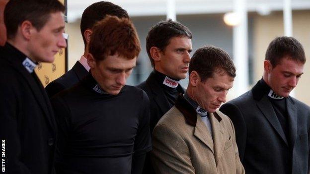 Jockeys at Cheltenham observe a minute's silence