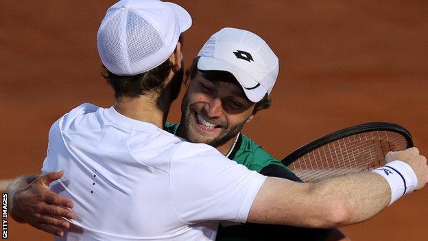 Liam Broady and Andy Murray celebrate winning their Italian Open doubles match