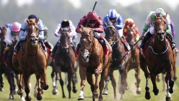 Frankie Dettori wins on Wings Of desire (red)