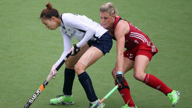 GB's Alex Danson (right) challenges South Korea's Ji Hyun Kim