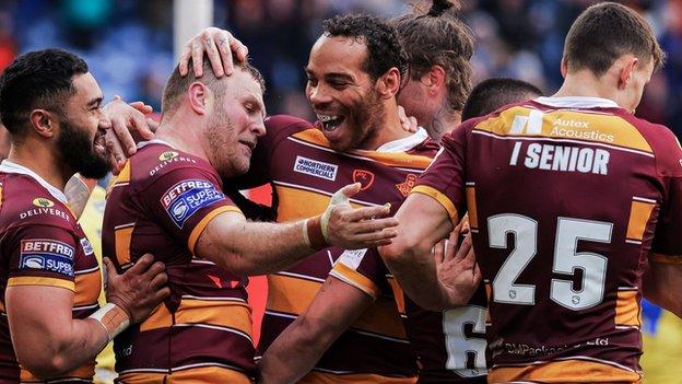 Huddersfield ran in three first-half tries to set themselves on the road to victory