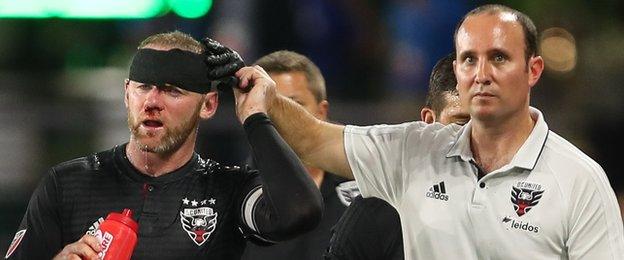 Wayne Rooney is given a headband to complete treatment