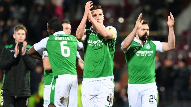 Hibs captain Paul Hanlon applauds visiting fans at Tynecastle