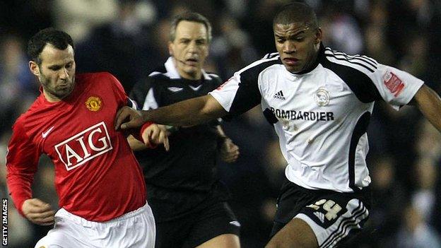 Manchester United's Ryan Giggs is tackled by Miles Addison of Derby