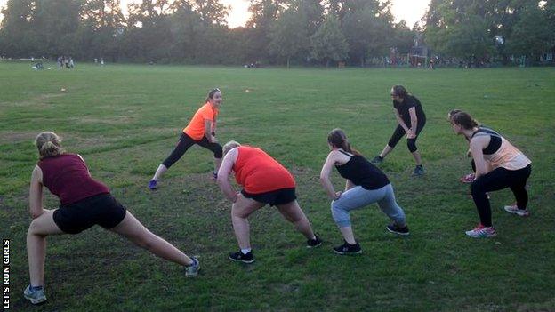 Let's Run Girls founder Danielle Guy leads a stretching session