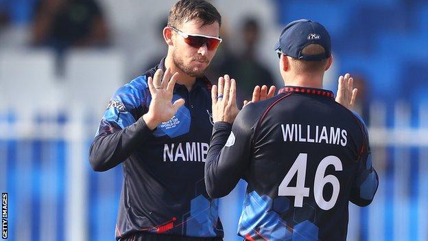 Gerhard Erasmus and Craig Williams celebrate a wicket