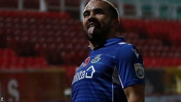 Eastleigh midfielder Jai Reason celebrates scoring against Swindon