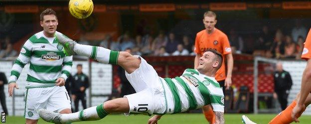 Celtic striker Anthony Stokes tries an acrobatic shot against Dundee United