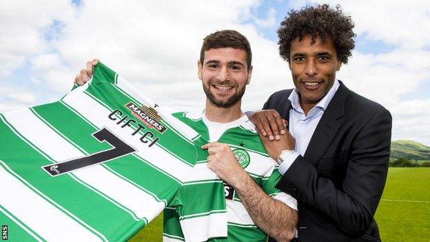 Nadir Ciftci and agent Pierre van Hooijdonk with the Celtic No.7 jersey