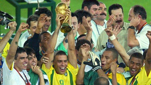 Former Brazil striker Ronaldo lifts the World cup