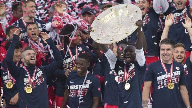 Naby Keita holds aloft the Austrian Bundesliga shield