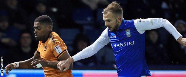 Ivan Cavaleiro of Wolverhampton Wanderers and Jordan Rhodes of Sheffield Wednesday