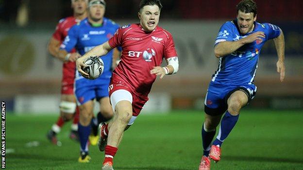 Steff Evans races clear to open the scoring at Parc y Scarlets