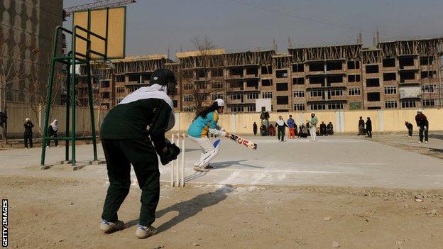 A woman playing cricket in Afghanistan in 2013