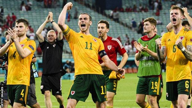 Gareth Bale (centre) and his Wales team-mates celebrate their 2-0 win over Turkey in Baku at Euro 2020