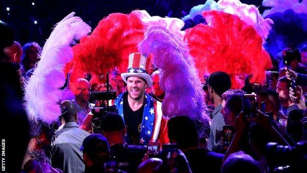 Fury walked to the ring in US colours after taking off an all-black robe