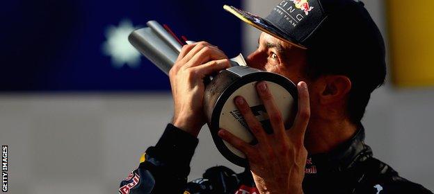 Daniel Ricciardo kisses the trophy