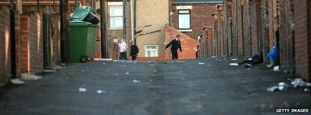 Children playing on a run-down street