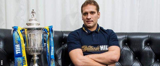 Stiliyan Petrov poses beside the Scottish Cup, a trophy he won three times with Celtic