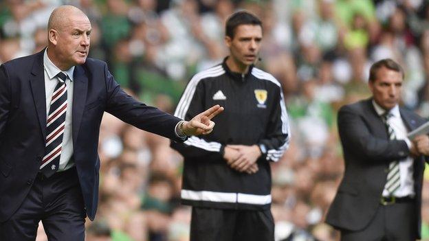 Mark Warburton makes a point to his players in Rangers' 5-1 defeat by Celtic as Brendan Rodgers looks on