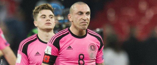 Scott Brown (centre) and James Forrest (rear) look dejected after Scotland's defeat by England