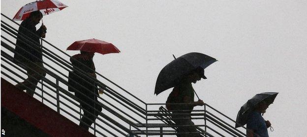 Fans try to keep dry during last year's rain-sodden US Grand Prix