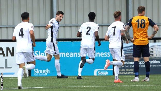 Dartford players celebrate a goal