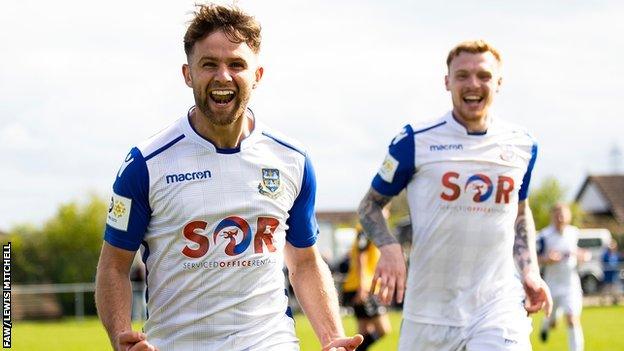 Llantwit Major's Ben Cripps celebrates after scoring his side's opening goal against Undy.