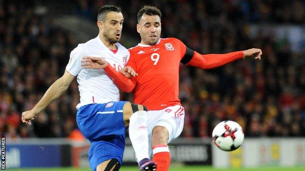 Wales forward Hal Robson-Kanu battles for the ball with Nikola Maksimovic of Serbia